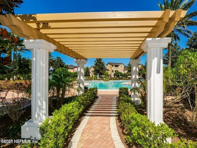 view of swimming pool with a pergola