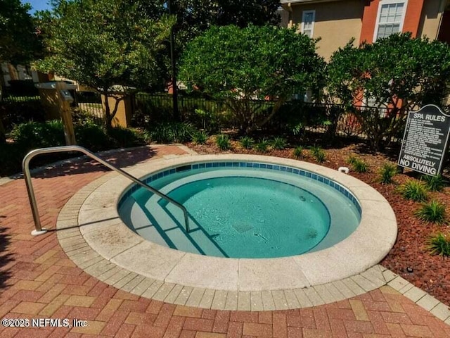 view of pool featuring a community hot tub