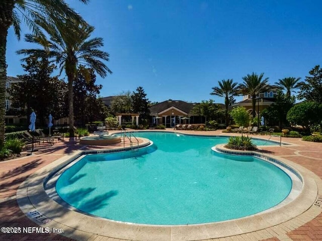 view of pool featuring a patio area