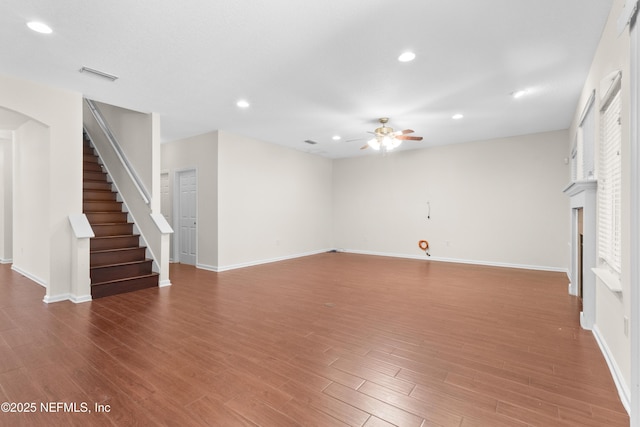 unfurnished living room featuring hardwood / wood-style floors and ceiling fan