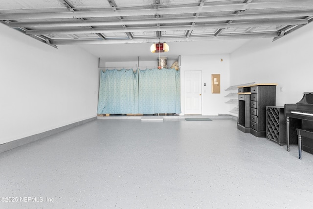 garage featuring a garage door opener and electric panel