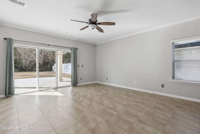 spare room featuring crown molding, light tile patterned floors, and a textured ceiling