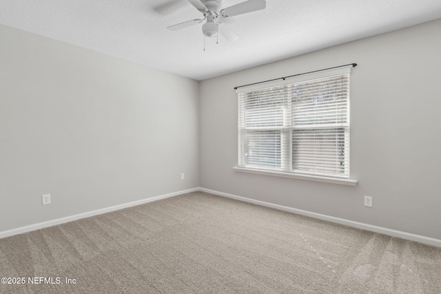 empty room with carpet floors and ceiling fan