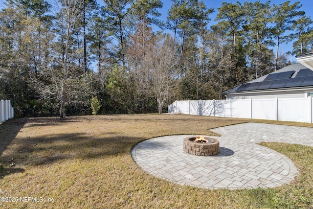 view of yard featuring a patio and an outdoor fire pit