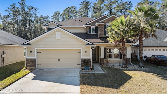 view of front of home with a garage and a front lawn