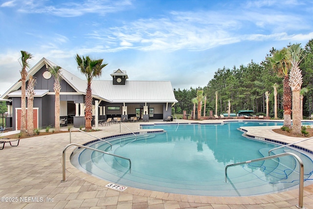 view of swimming pool featuring a patio