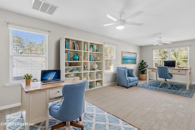 office with ceiling fan and light colored carpet