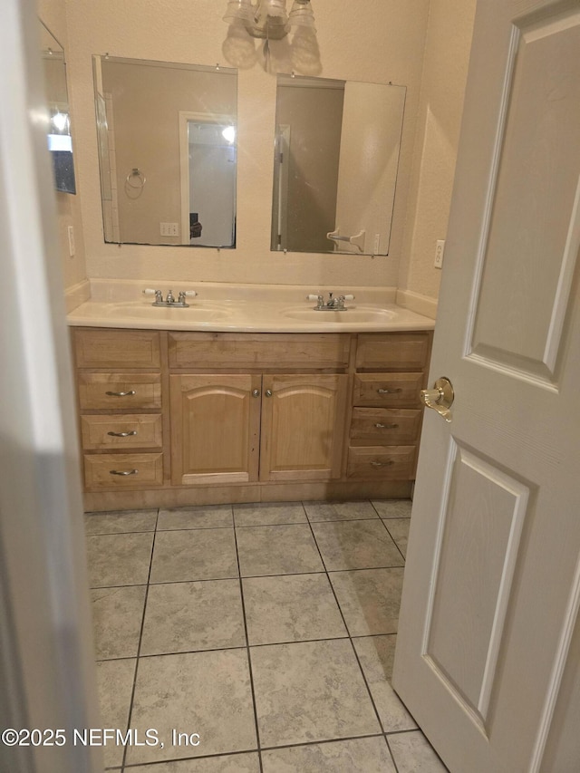 bathroom with vanity and tile patterned flooring