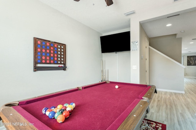 recreation room with visible vents, ceiling fan, baseboards, and wood finished floors