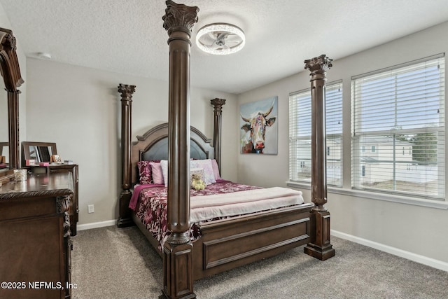 bedroom with carpet flooring, a textured ceiling, and baseboards