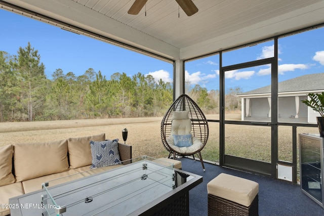 sunroom with a ceiling fan