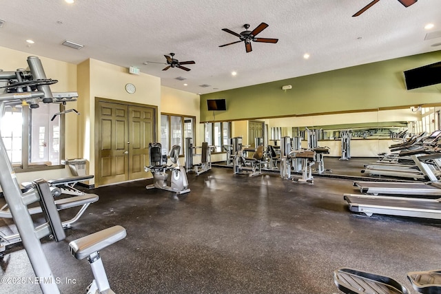 workout area with a textured ceiling, recessed lighting, visible vents, and a ceiling fan