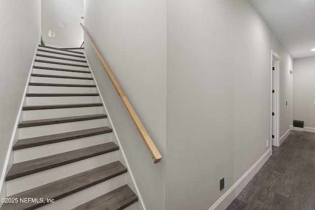 staircase with wood-type flooring