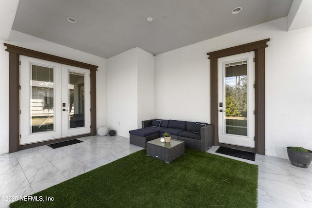 unfurnished living room with french doors