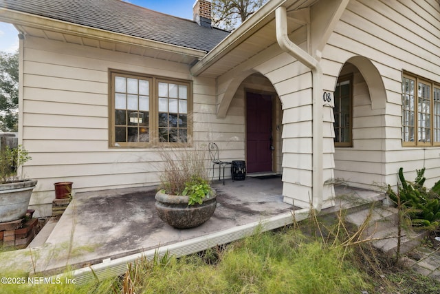 doorway to property with a patio area