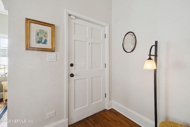 entryway with dark wood-type flooring