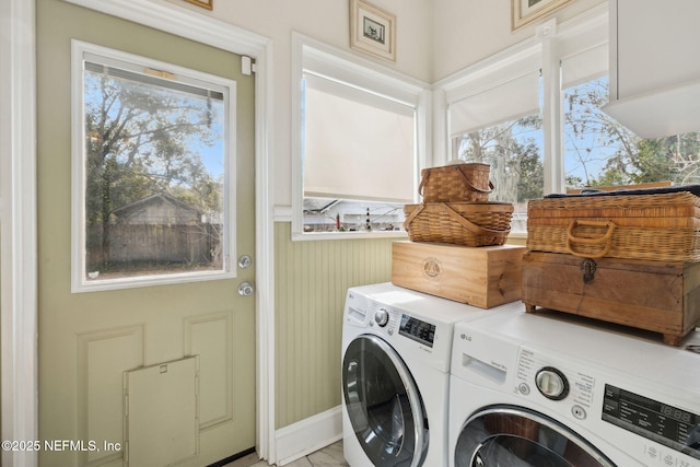 laundry area with washing machine and clothes dryer