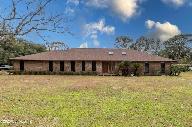 ranch-style house with a front lawn