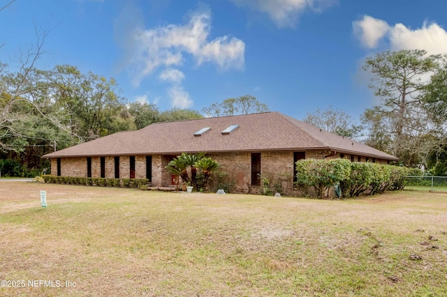 view of side of home featuring a lawn