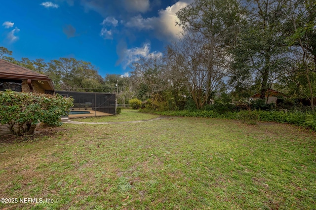 view of yard featuring a lanai