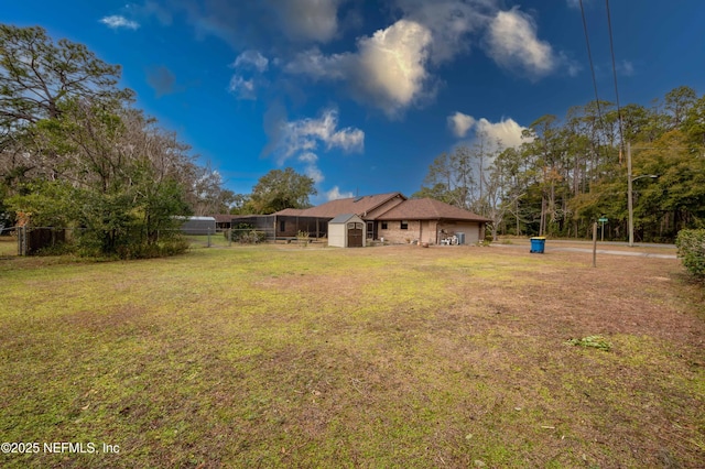 view of yard with a storage unit