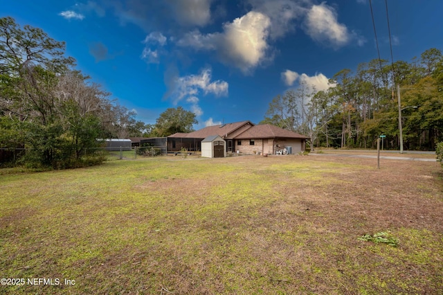 view of yard with a storage shed