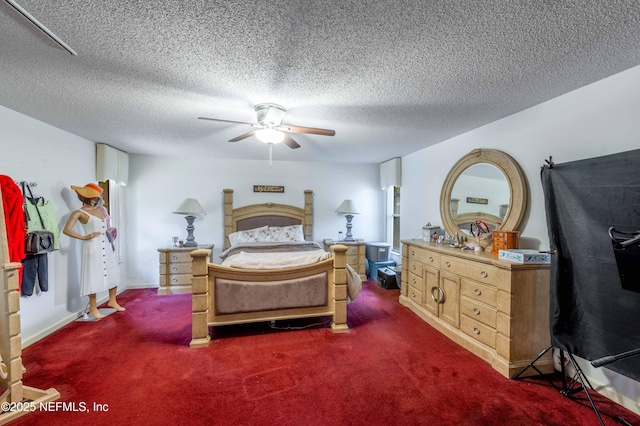 bedroom featuring dark carpet, a textured ceiling, and ceiling fan