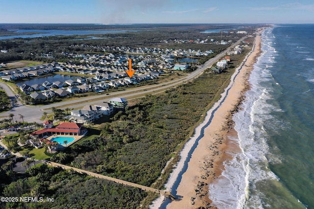 bird's eye view featuring a view of the beach and a water view