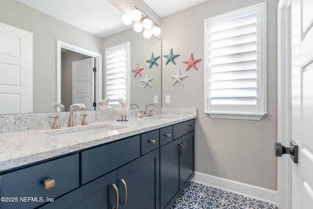 bathroom with vanity and tile patterned flooring