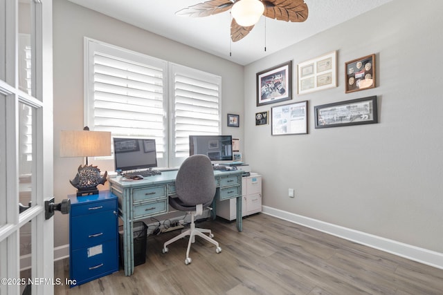 office area with french doors, ceiling fan, and hardwood / wood-style floors