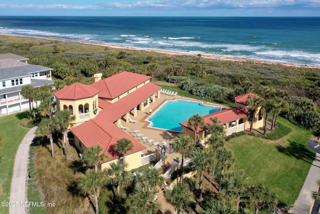 drone / aerial view featuring a view of the beach and a water view