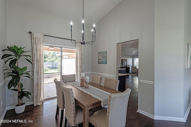 dining room featuring high vaulted ceiling, a notable chandelier, and dark hardwood / wood-style flooring