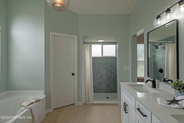 bathroom with plus walk in shower and vanity