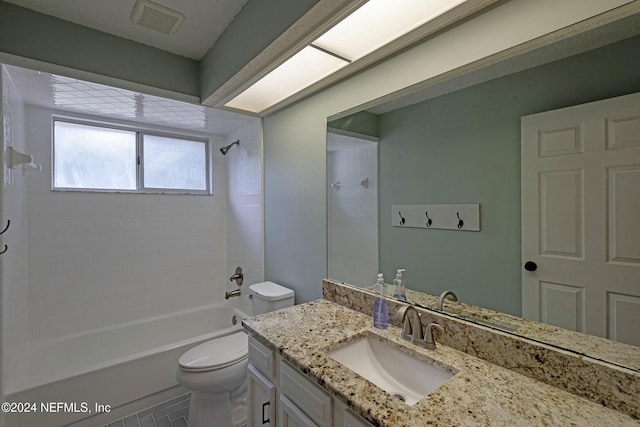 full bathroom featuring tile patterned floors, vanity, toilet, and  shower combination