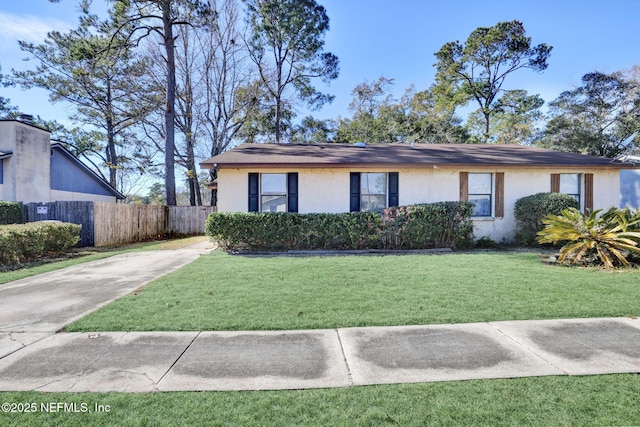 ranch-style home with a front lawn