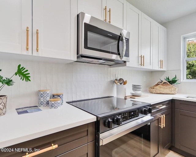 kitchen featuring white cabinetry and stainless steel appliances