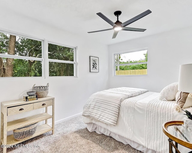 bedroom with light carpet and ceiling fan