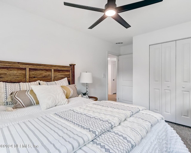 bedroom featuring ceiling fan, carpet flooring, and a closet