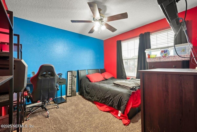 bedroom featuring carpet, a textured ceiling, and ceiling fan