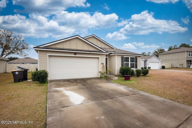 view of front facade featuring a garage and a front lawn