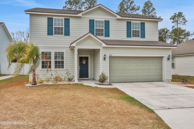 view of front of house with a garage and a front yard