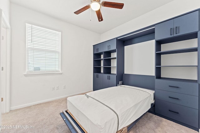 bedroom featuring ceiling fan and carpet floors