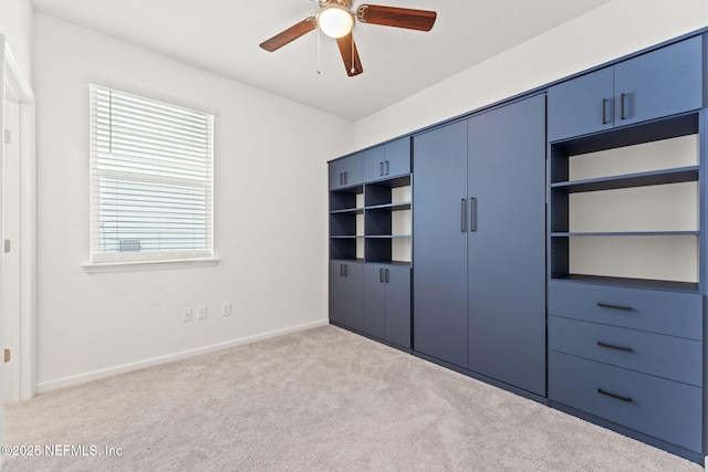 unfurnished bedroom with light carpet and ceiling fan