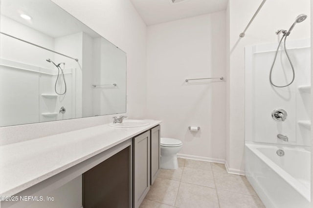 full bathroom with washtub / shower combination, vanity, toilet, and tile patterned floors