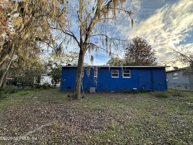 back of property featuring central AC unit