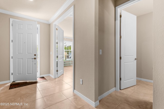 tiled entrance foyer with ornamental molding