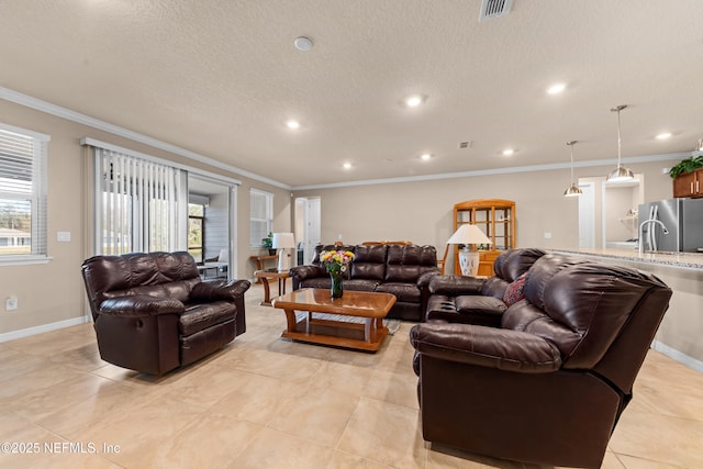 living room featuring light tile patterned floors, ornamental molding, and a textured ceiling