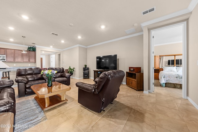 living room with ornamental molding and light tile patterned floors