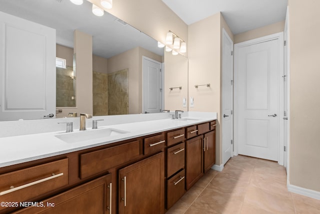 bathroom featuring walk in shower, tile patterned floors, and vanity