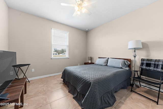 tiled bedroom with ceiling fan